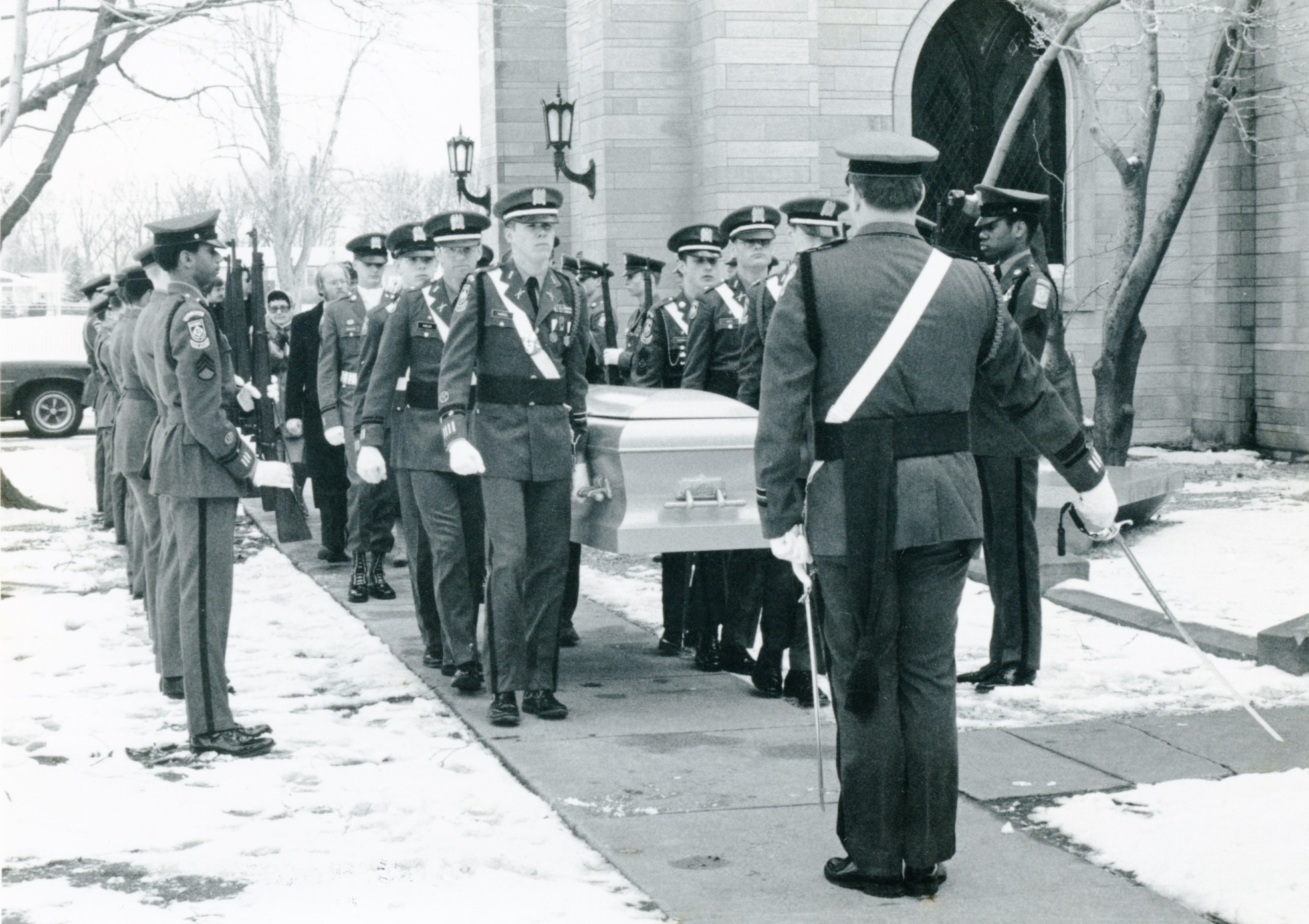 Cadet pallbearers carry the casket of Bishop Walter Conrad Klein into the Crypt for burial